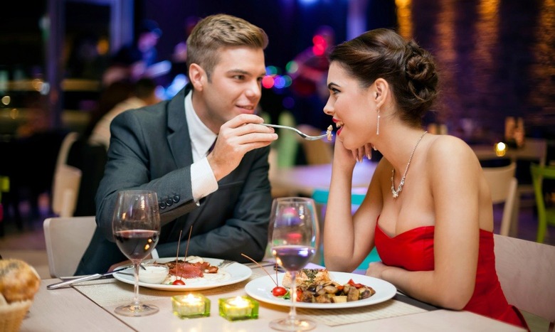 Couple sharing a romantic dinner, used in an AI-generated Valentine's offer promo