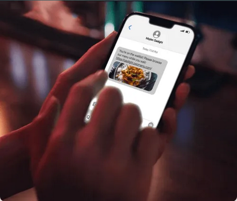 Phone screen showing a text message with a link to place an online order