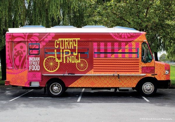 Curry Up Now food truck with bold pink and orange patterns