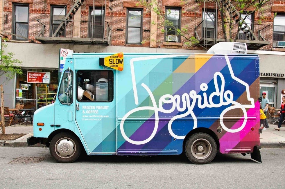Joyride food truck with a colorful geometric bicycle design