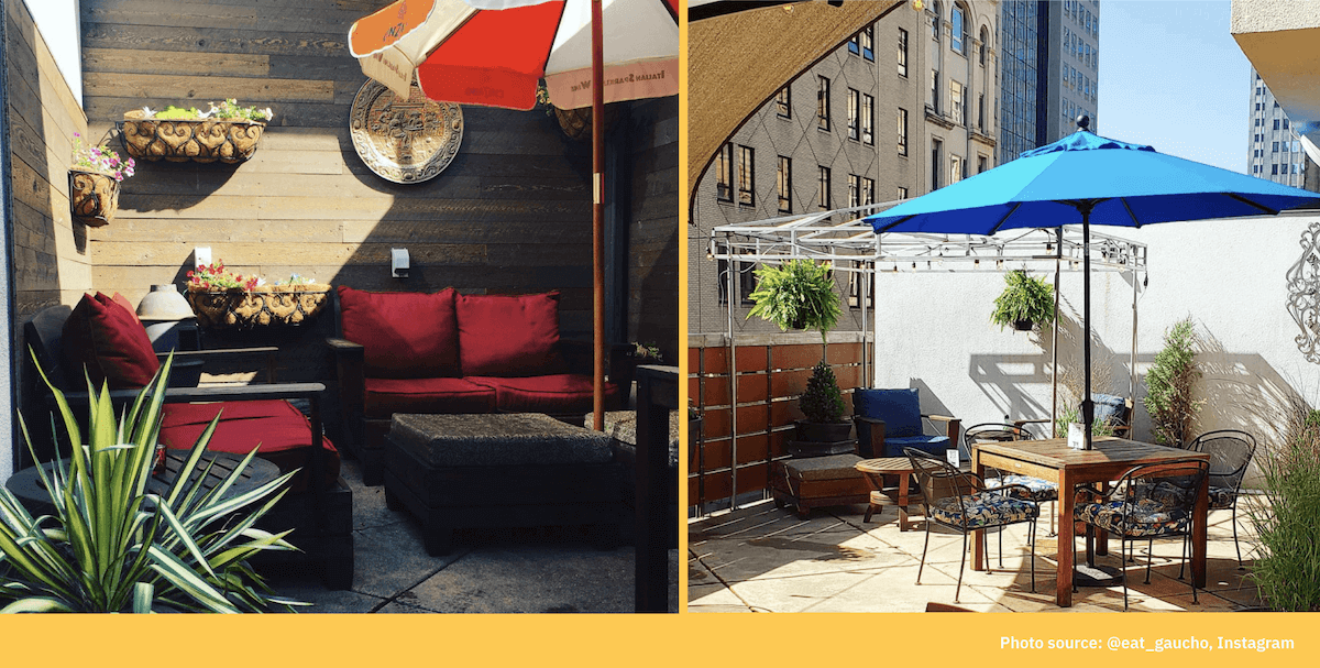 A cozy patio lounge with a red couch and umbrella next to a rooftop dining table with a blue umbrella