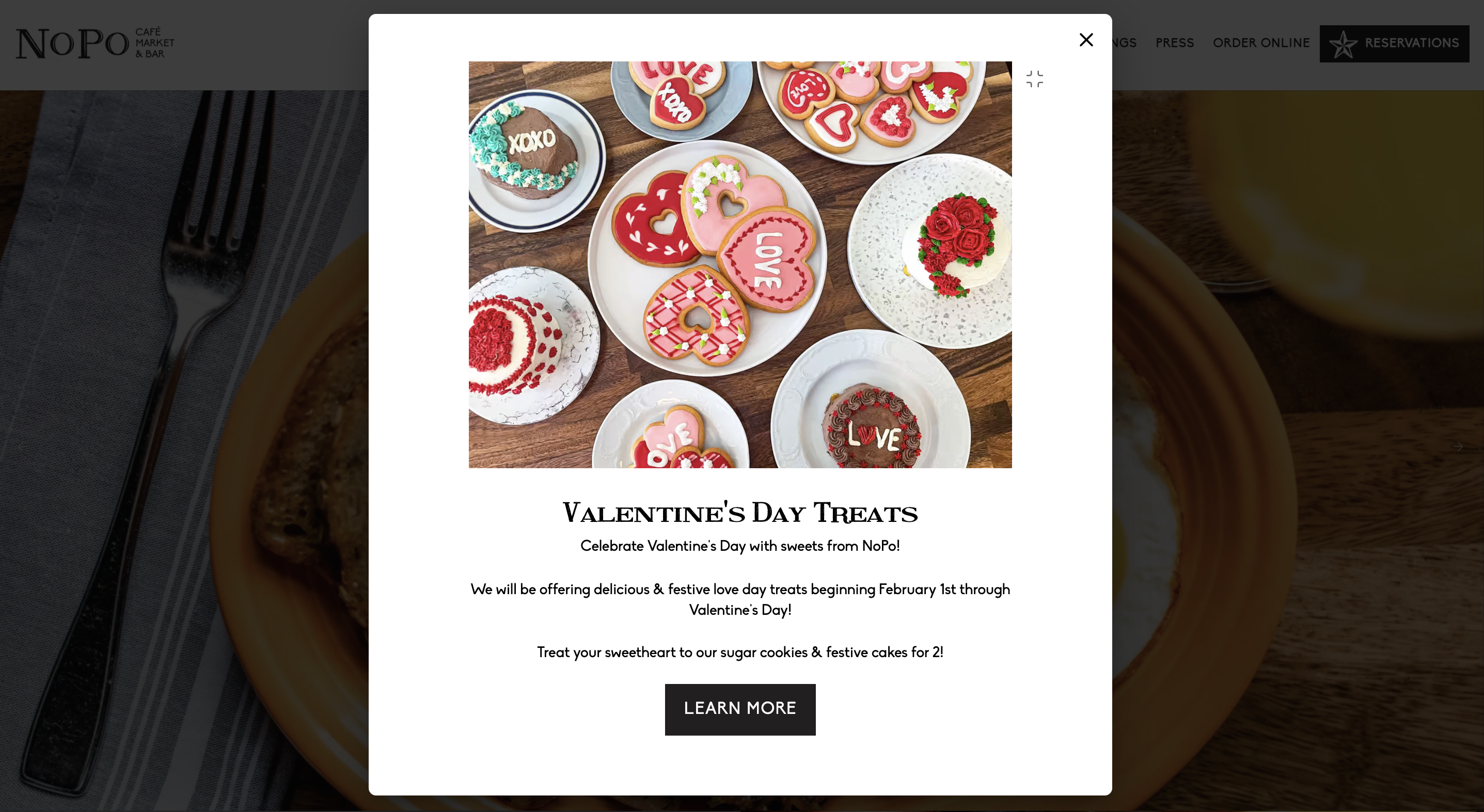NoPo website popup advertising Valentine’s Day treats with heart-shaped cookies and cakes