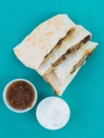 Quesadilla wedges with salsa and sour cream