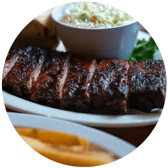 A rack of ribs with coleslaw at Winking Lizard Tavern