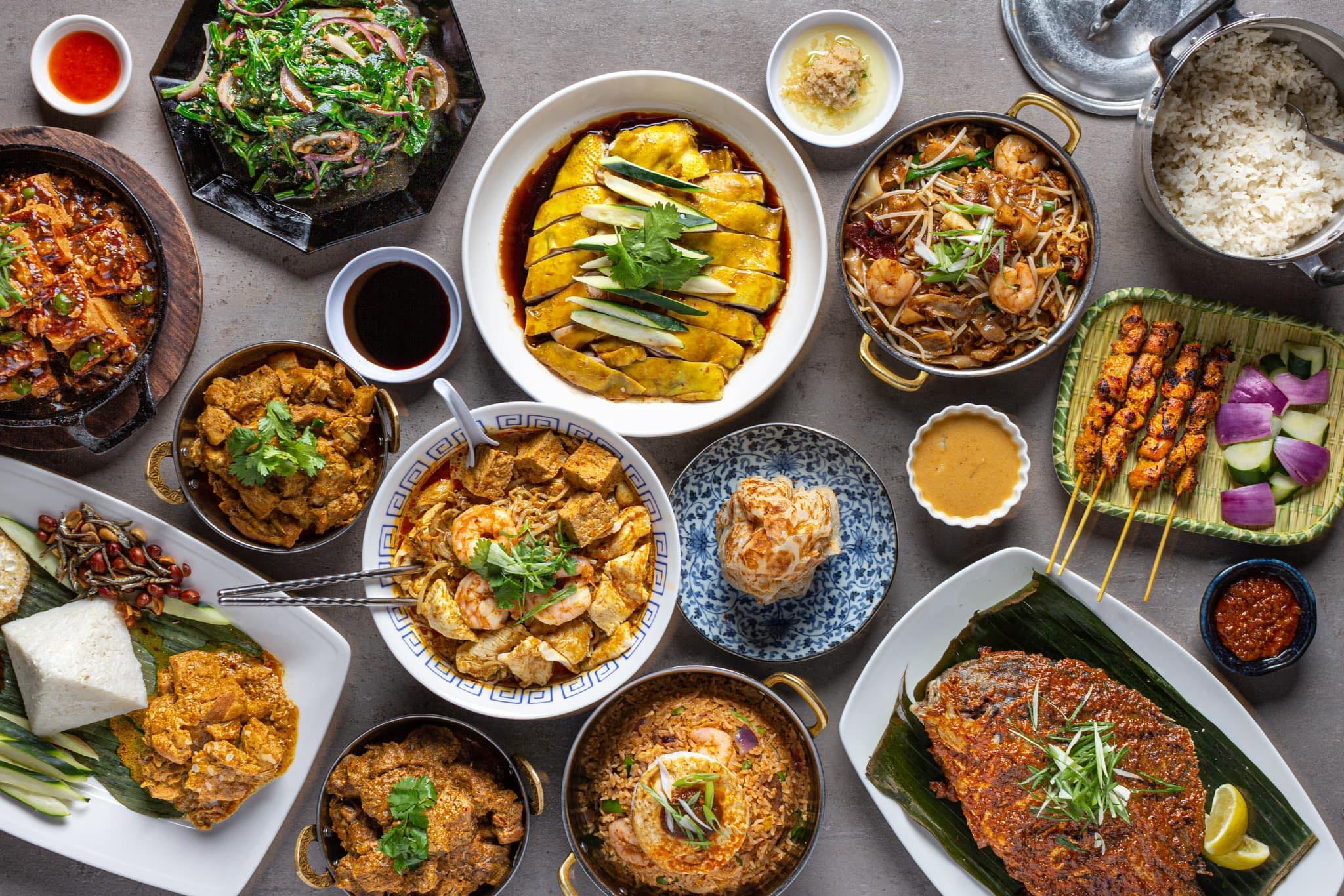 Phat Eatery's Thanksgiving feast spread, including beef rendang wellington